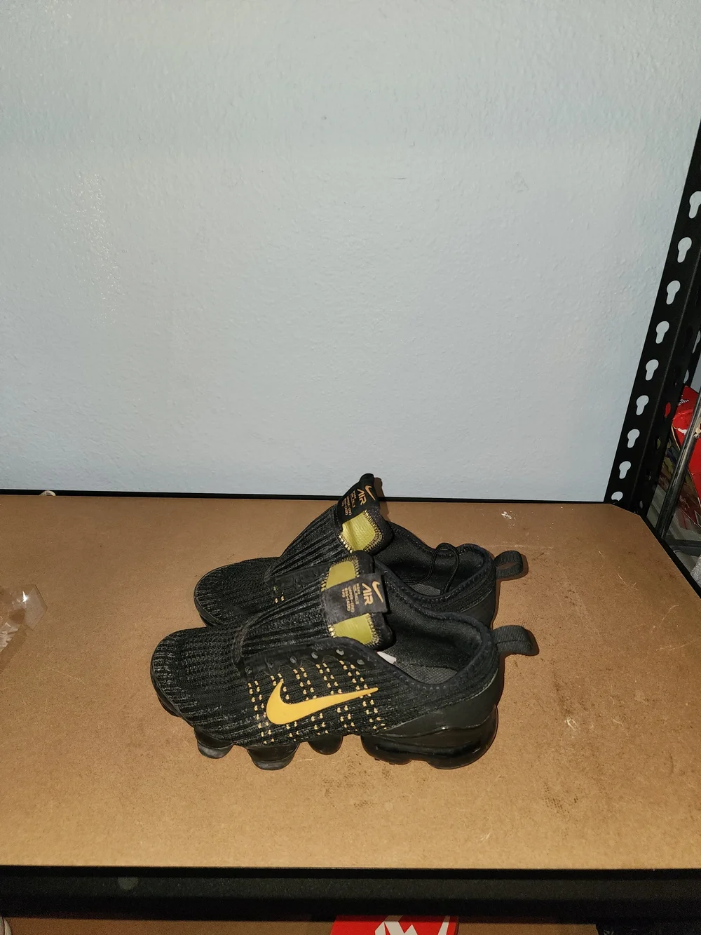 Nike Kids Black and Gold Slip-On Athletic Sneakers